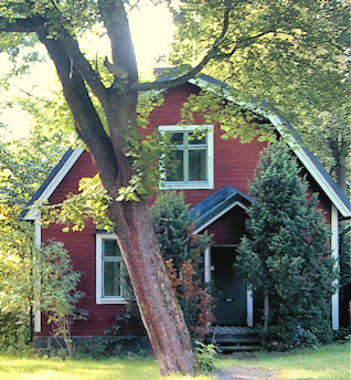 Red cottage with white trim